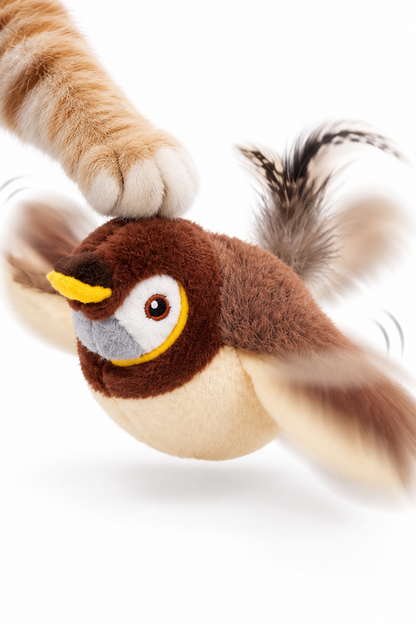 Detalle del pájaro interactivo de peluche batiendo sus alas